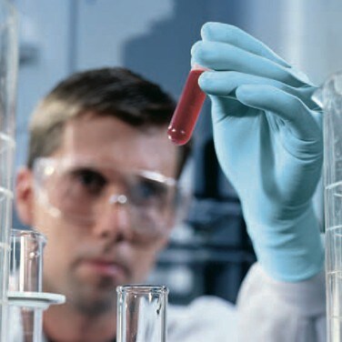 A scientist using Ansell ergonomically certified gloves
